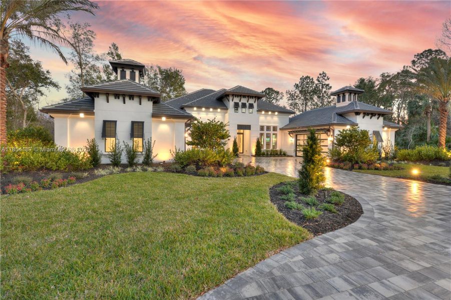Front exterior of a new home in The Estates at Brown's Landing, Port Orange, FL, highlighting curb appeal (Image 2).