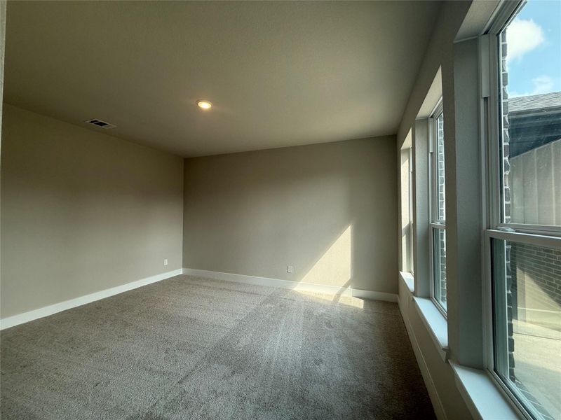 Enjoy looking out to your courtyard first thing in the morning from your main bedroom.