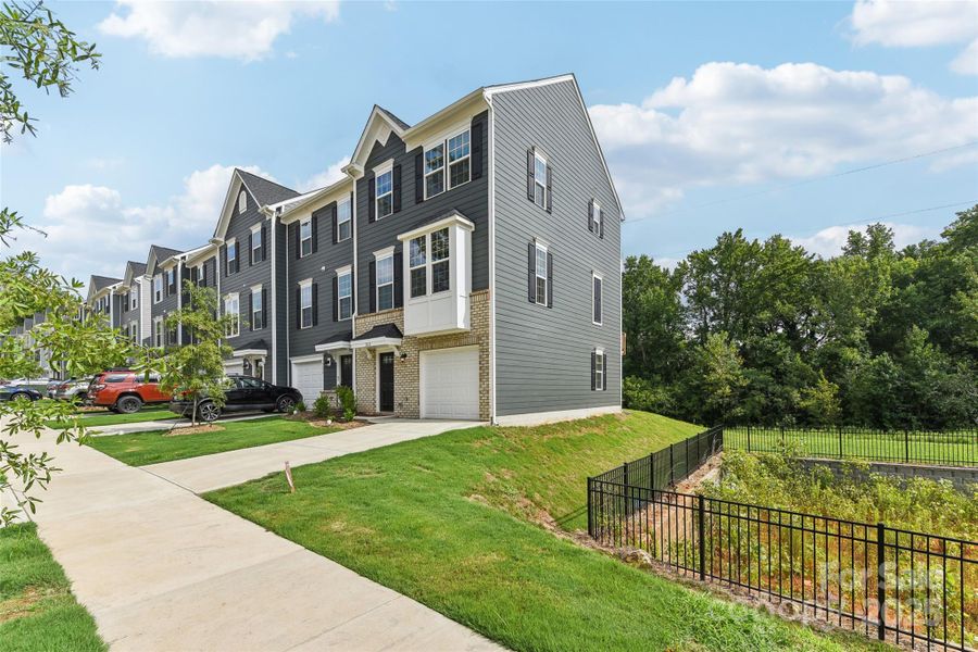 Front exterior of a new home in Villages at Beachmont, Charlotte, NC, highlighting curb appeal (Image 18).