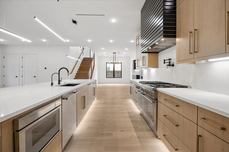 All appliances are high-end Thermador. Fine contemporary inspiration cabinet, drawer and door hardware is evident in all areas of the home.