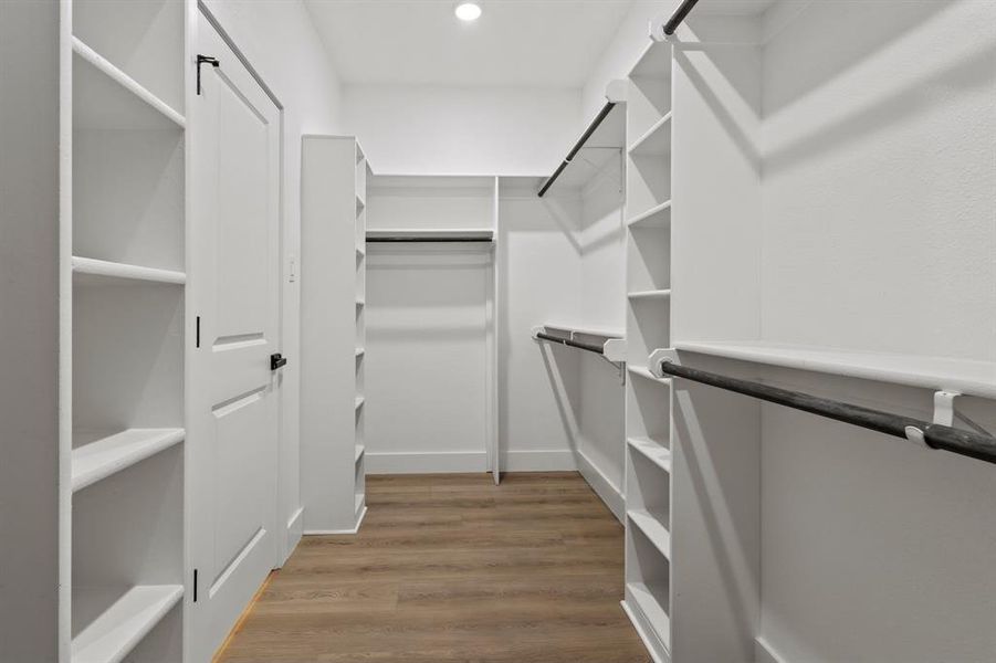 Spacious closet with wood finished floors