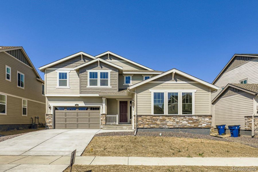 Front exterior of a new home in Brighton Crossings: The Grand Collection, Brighton, CO, highlighting curb appeal (Image 15). Front exterior of a new home in Brighton Crossings: The Grand Collection, Brighton, CO, highlighting curb appeal (Image 15).