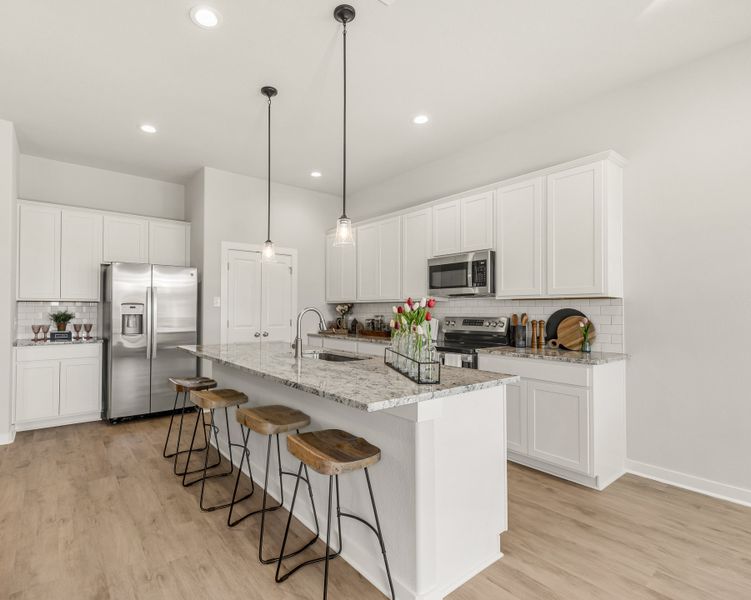 Representative furnished interior of a home built from the The Azalea by Avonley Homes in Pinemont, Bryan (Image 3).