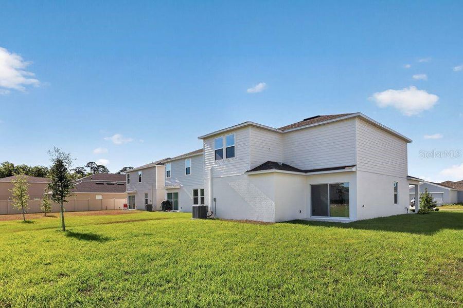 Exterior details and patio area of a home in Palm Wind, Hudson (Image 3).