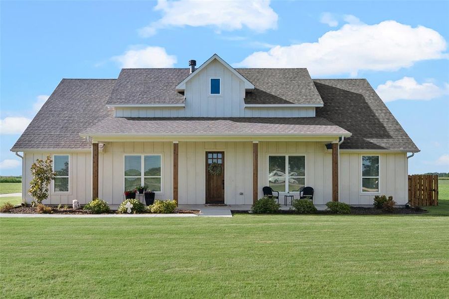 View of front of property with a front yard