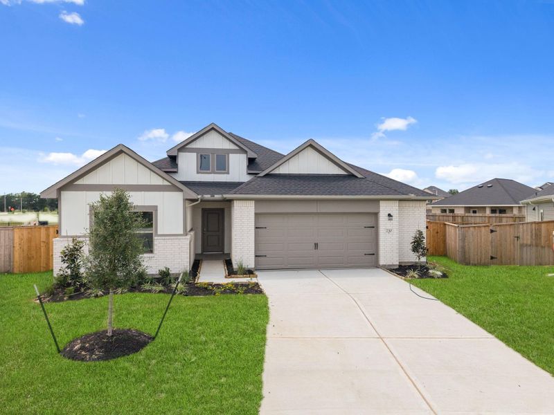 Front exterior of a new home in Laurel Landing, Alvin, TX, highlighting curb appeal (Image 18). Front exterior of a new home in Laurel Landing, Alvin, TX, highlighting curb appeal (Image 18).
