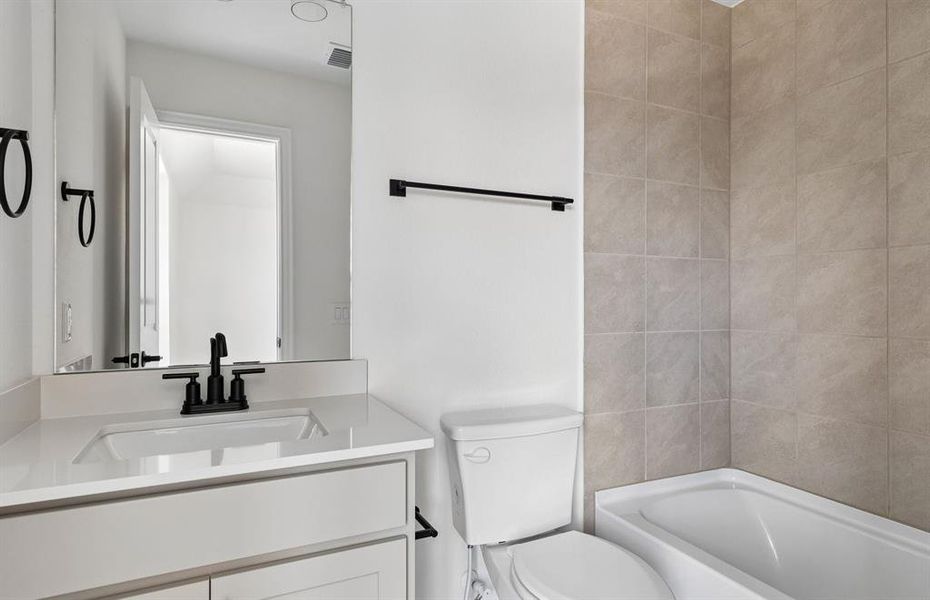 Secondary bath with tile surrounded shower