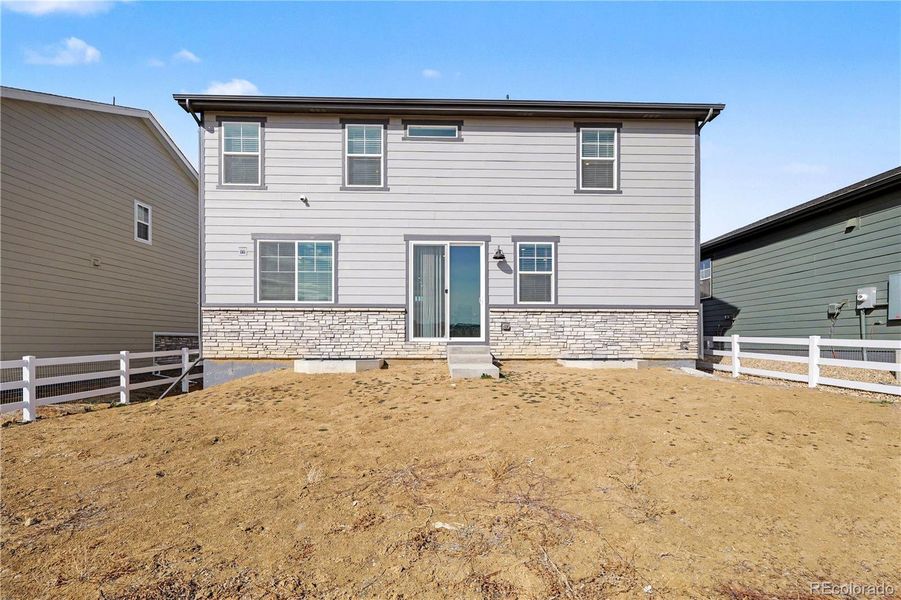 Exterior details and patio area of a home in Murphy Creek, Aurora (Image 26).