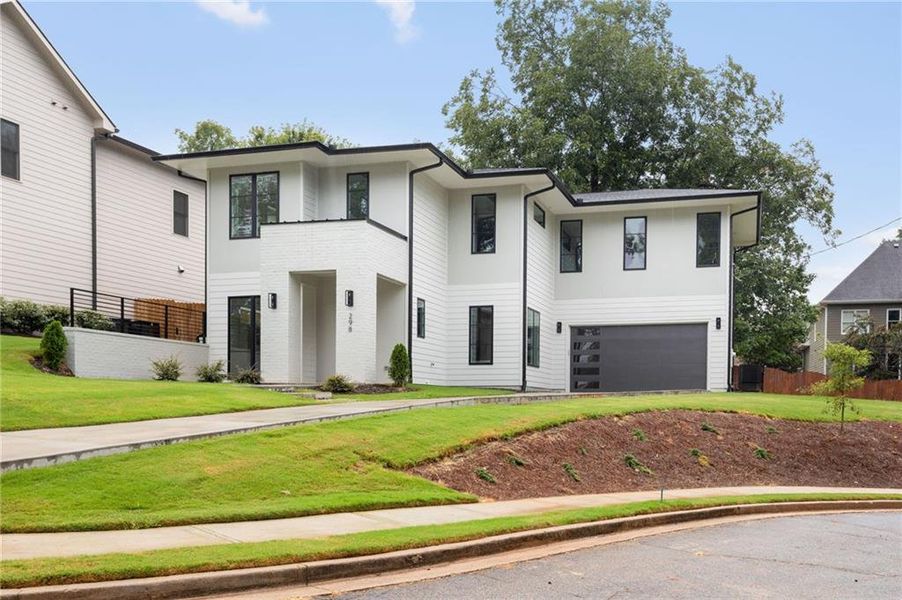 Front exterior of a new home in , Scottdale, GA, highlighting curb appeal (Image 2). Front exterior of a new home in , Scottdale, GA, highlighting curb appeal (Image 2).
