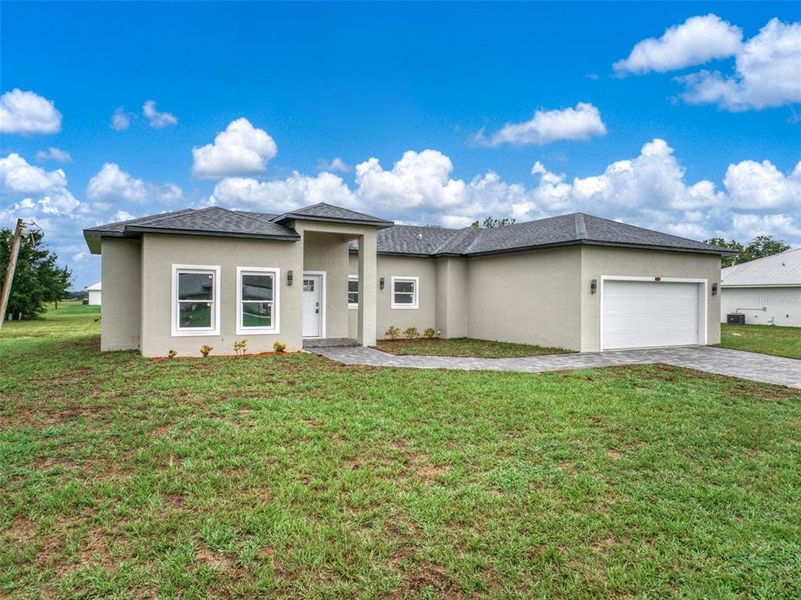 Front exterior of a new home in , Sebring, FL, highlighting curb appeal (Image 2).