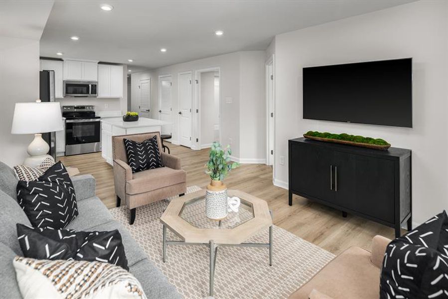 Representative furnished interior of a home built from the Beech by Ryan Homes in Highland Park Condos, White House (Image 5).