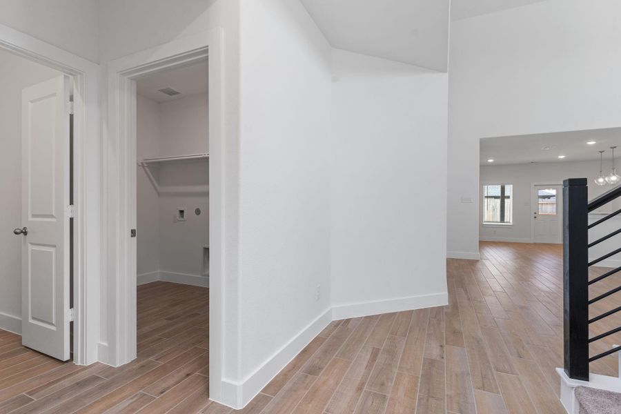 Transition from the private areas into the heart of the home with seamless wood-look tile flooring throughout. The open layout and clean lines offer both comfort and functionality. Transition from the private areas into the heart of the home with seamless wood-look tile flooring throughout. The open layout and clean lines offer both comfort and functionality.