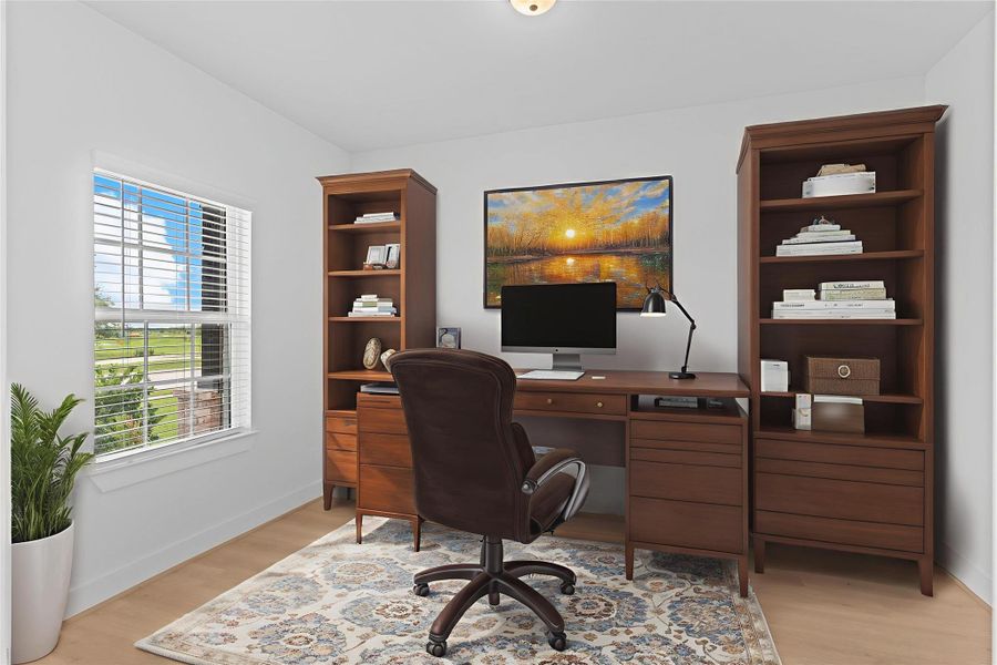 Double doors open to a dedicated home office or study nestled at the front of the home—an ideal space for productivity, quiet focus, or creative inspiration. *Virtually Staged Photo* **Image Representative of Plan Only and May Vary as Built**.