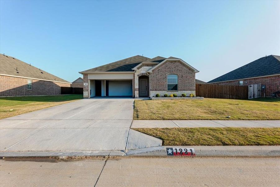 Front exterior of a new home in Azle Grove, Azle, TX, highlighting curb appeal (Image 25).