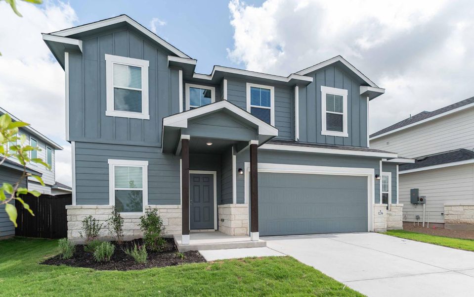 Front exterior of a new home in Swenson Heights, Seguin, TX, highlighting curb appeal (Image 2).
