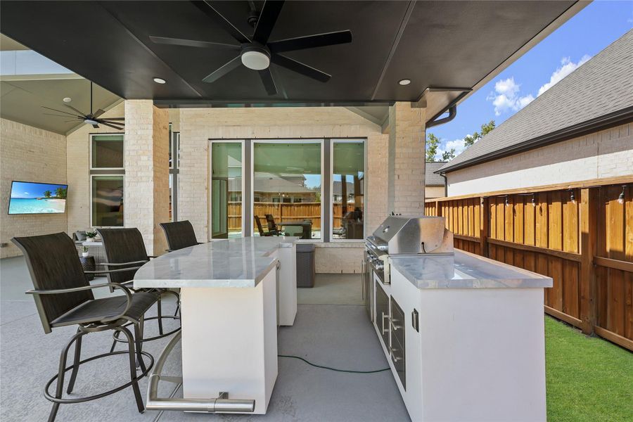 Exterior details and patio area of a home in Woodson’s Reserve, Spring (Image 25).