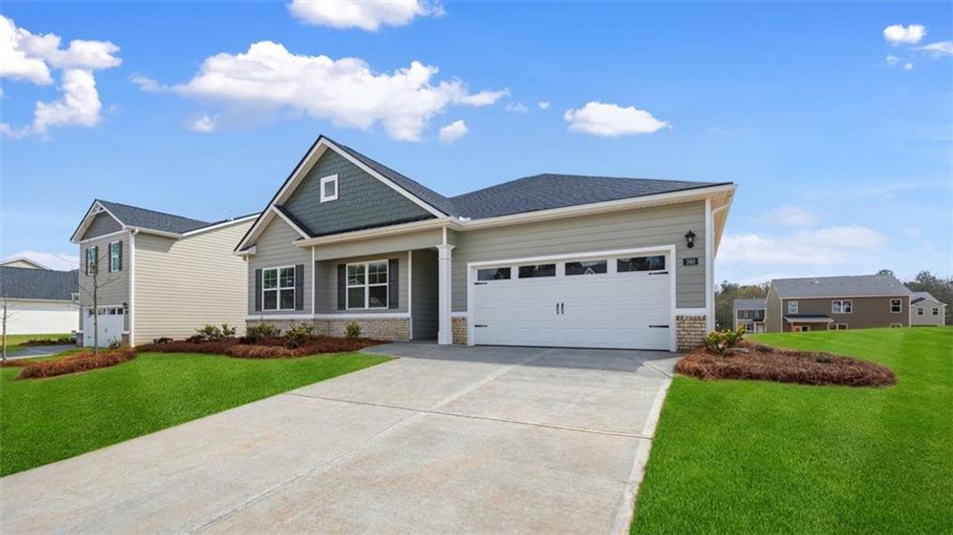 Front exterior of a new home in Preserve at Dove Creek, Statham, GA, highlighting curb appeal (Image 2). Front exterior of a new home in Preserve at Dove Creek, Statham, GA, highlighting curb appeal (Image 2).