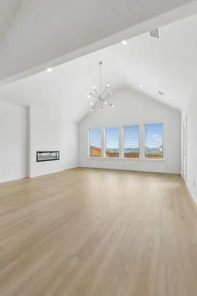 Living Room in the Claret home plan by Trophy Signature Homes – REPRESENTATIVE PHOTO