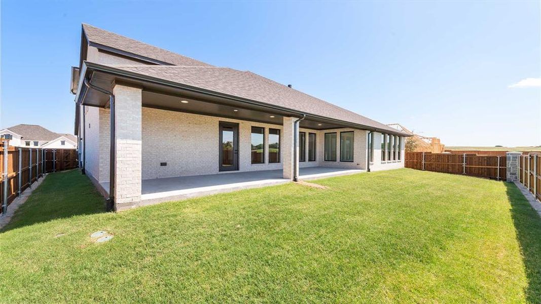 Front exterior of a new home in Terraces 82'/100', Rockwall, TX, highlighting curb appeal (Image 1).