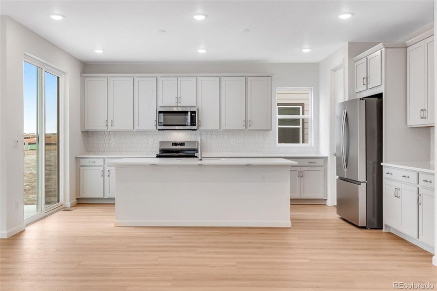 Furnished interior view inside a new home in Reunion, Commerce City (Image 6).