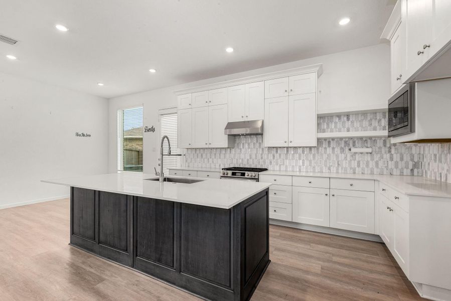 Furnished interior view inside a new home in Sunterra, Katy (Image 10).