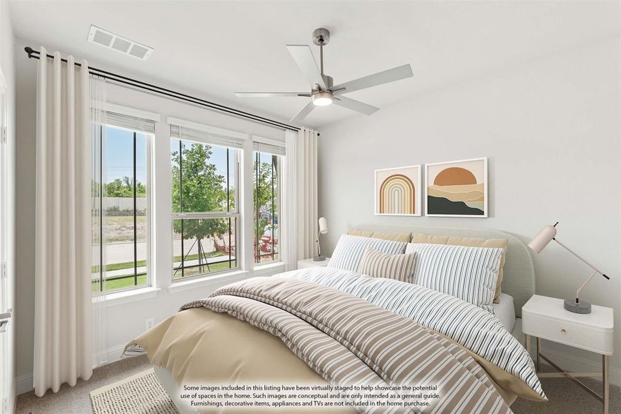 Bedroom with ceiling fan, large windows, and striped bedding on an upholstered bed Bedroom with ceiling fan, large windows, and striped bedding on an upholstered bed
