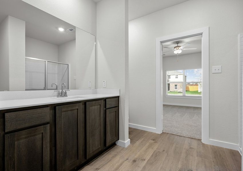 The master bathroom has a sprawling vanity.