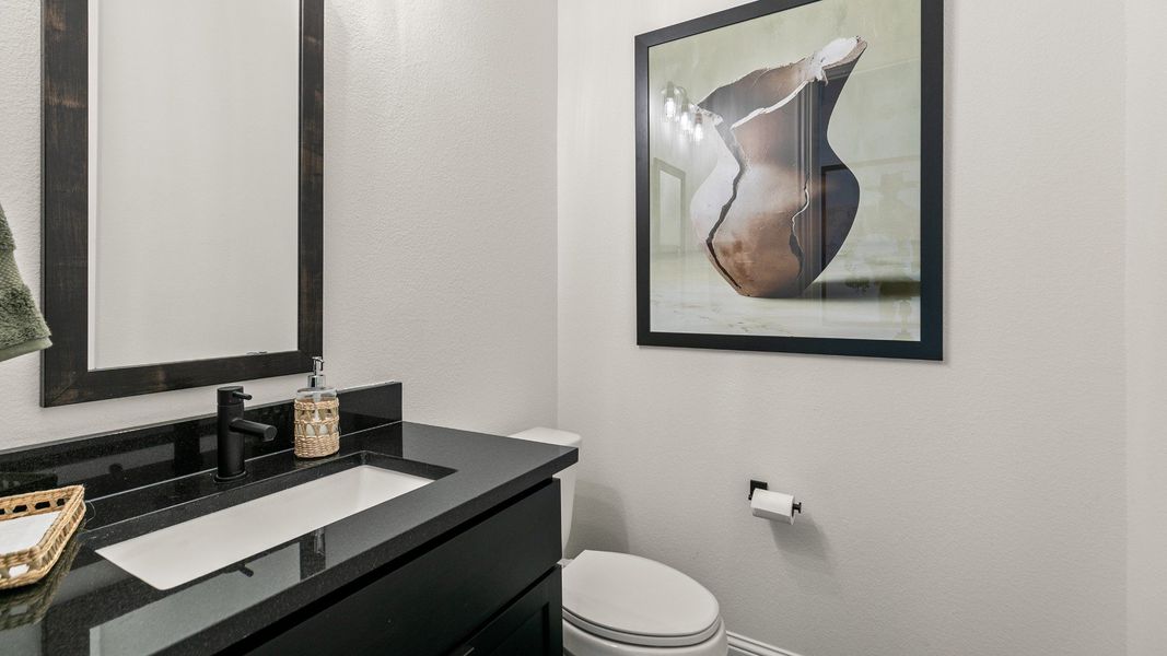 Representative furnished interior of a home built from the Rosewood by Brightland Homes in Sunterra, Katy (Image 7).