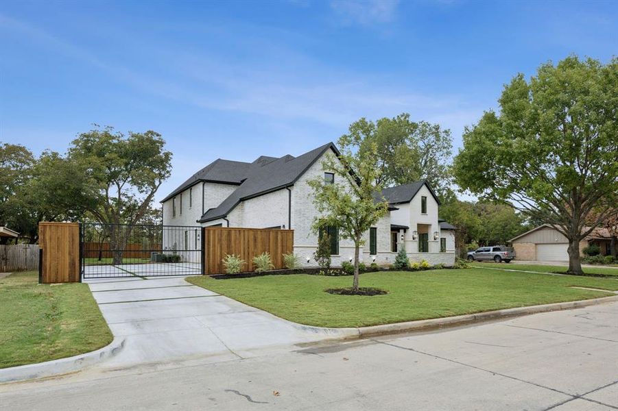 Large Driveway with privacy fence and electric gate