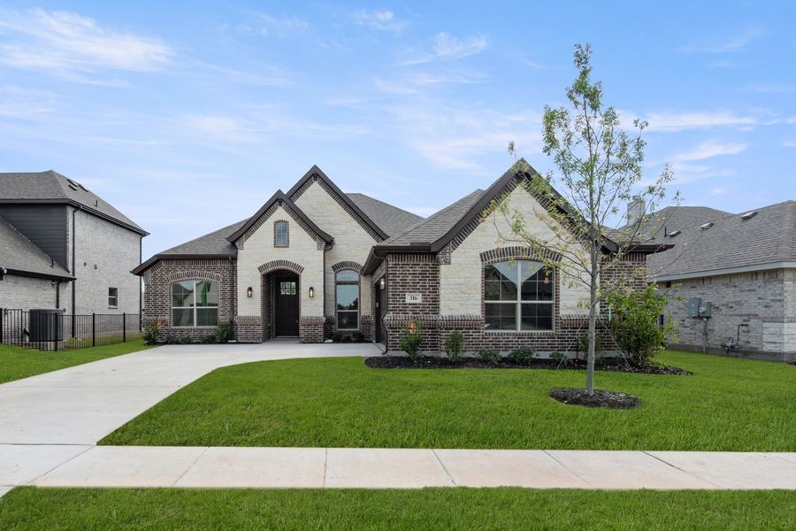 Front exterior of a new home in Abe's Landing, Granbury, TX, highlighting curb appeal (Image 20). Front exterior of a new home in Abe's Landing, Granbury, TX, highlighting curb appeal (Image 20).