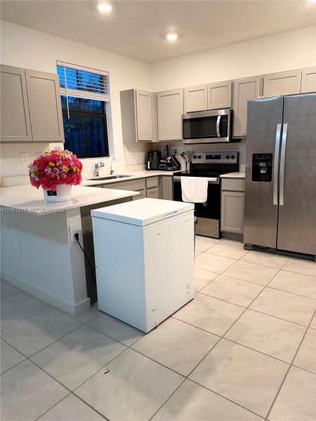 Furnished interior view inside a new home in , Florida City (Image 3).