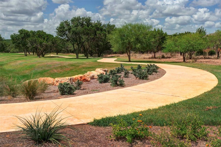 View of community featuring a yard View of community featuring a yard