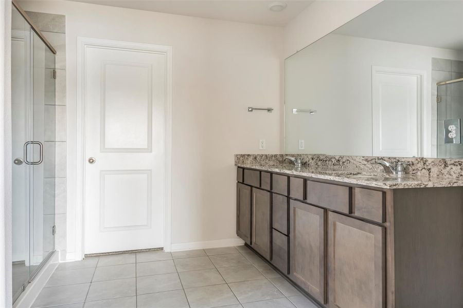 Furnished interior view inside a new home in Sunterra, Katy (Image 12).