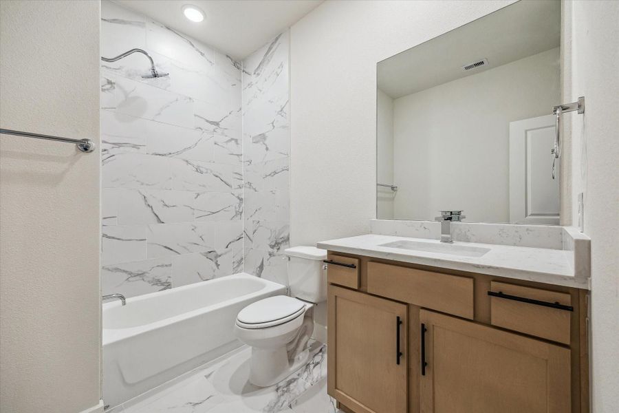 Secondary Bathroom – Previous work by the builder in the community, not representation of exact unit listed.