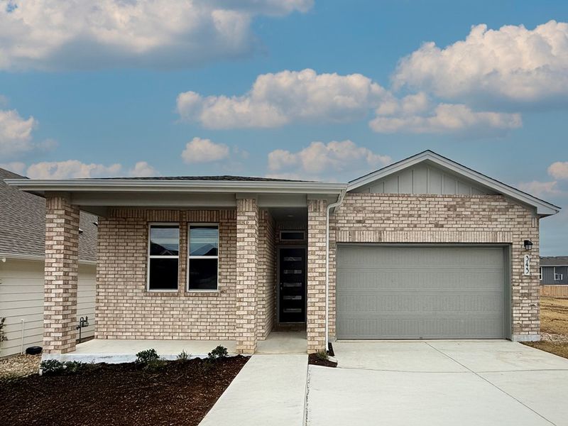 Front exterior of a new home in Porter Country, Kyle, TX, highlighting curb appeal (Image 1). Front exterior of a new home in Porter Country, Kyle, TX, highlighting curb appeal (Image 1).