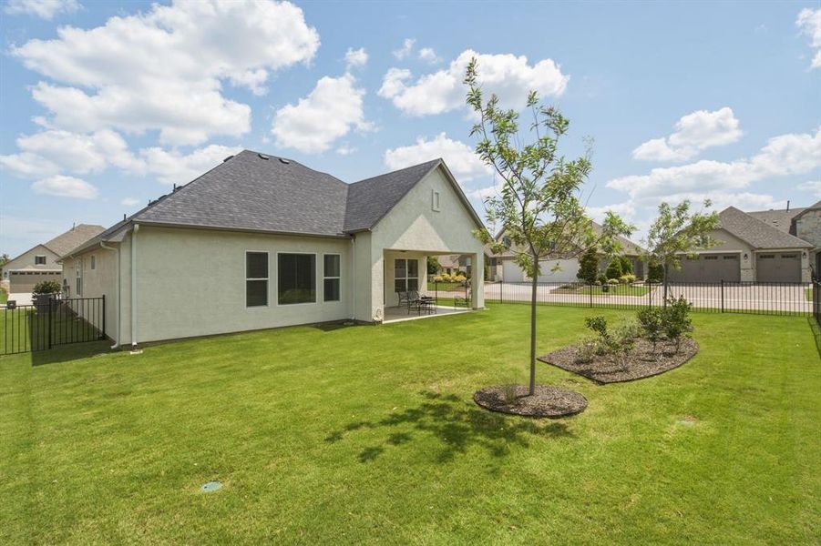 Exterior details and patio area of a home in , Denton (Image 4).