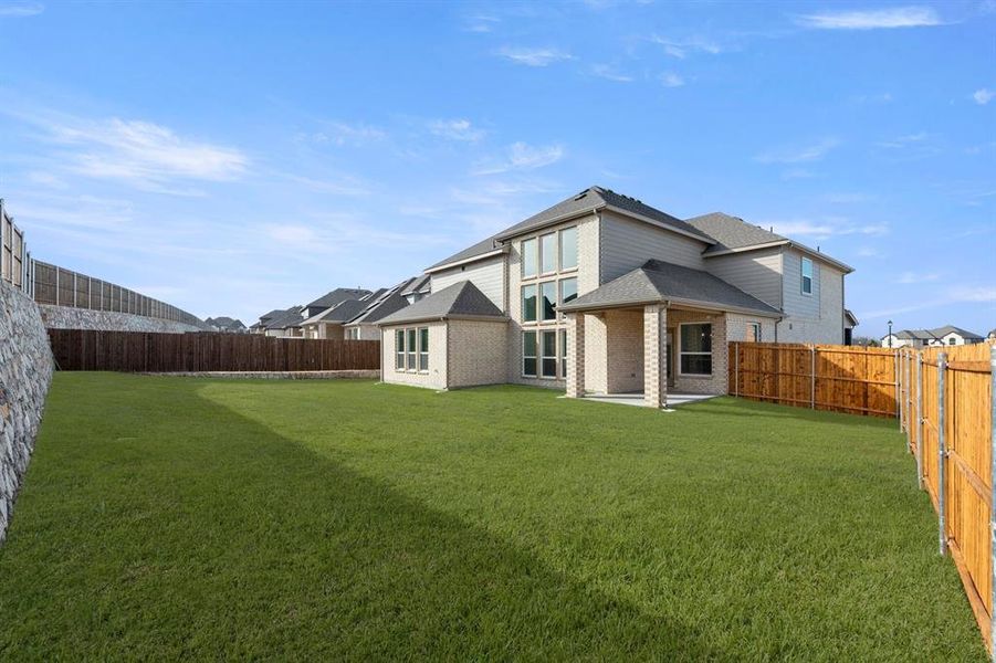 Exterior details and patio area of a home in Woodcreek, Fate (Image 2).
