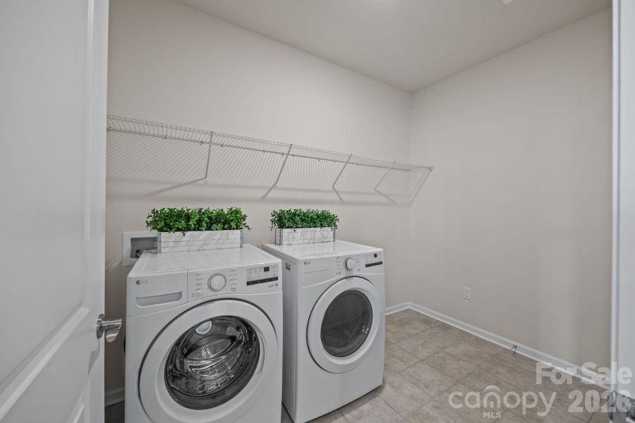 An extra heartbeat of the activity right off the kitchen.  Room for extra storage, supplies, and makes life easy to maintain without clutter.  Extra door leads to the voluminous garage.