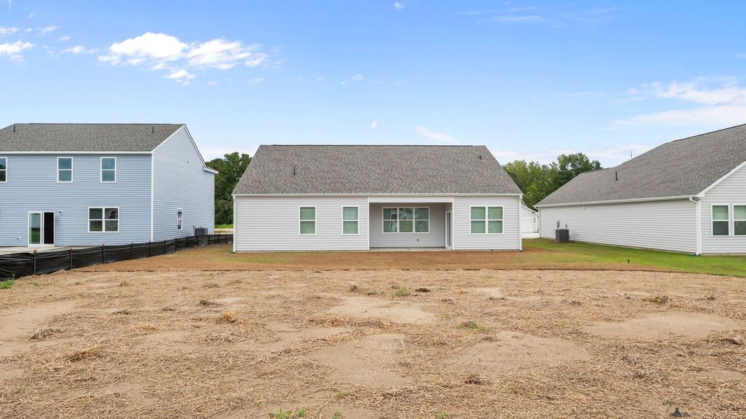 Front exterior of a new home in Villa Grande, Winterville, NC, highlighting curb appeal (Image 19). Front exterior of a new home in Villa Grande, Winterville, NC, highlighting curb appeal (Image 19).