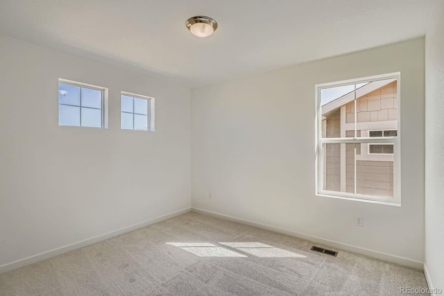 Spacious, unfurnished interior of a new home in Parterre: Paired Homes, Thornton (Image 9).