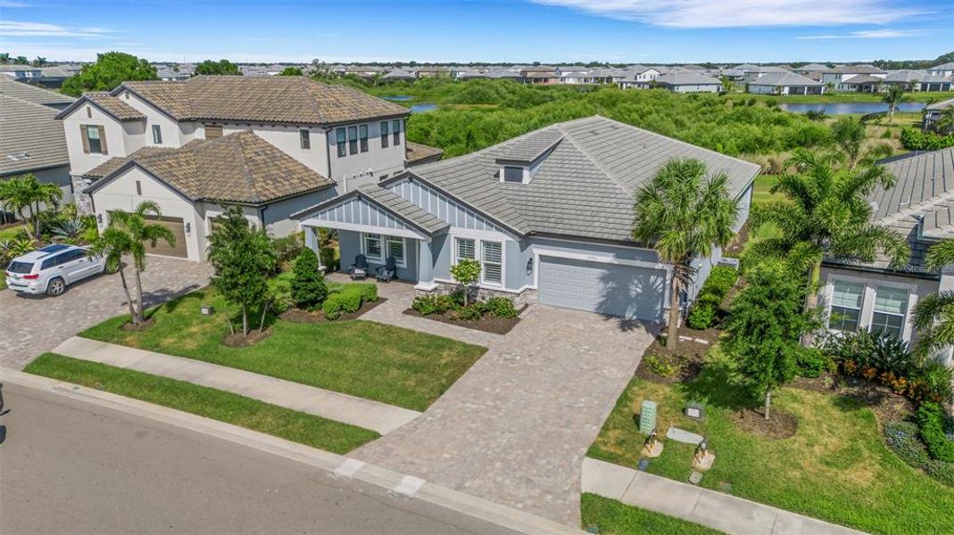Front exterior of a new home in , Bradenton, FL, highlighting curb appeal (Image 24).