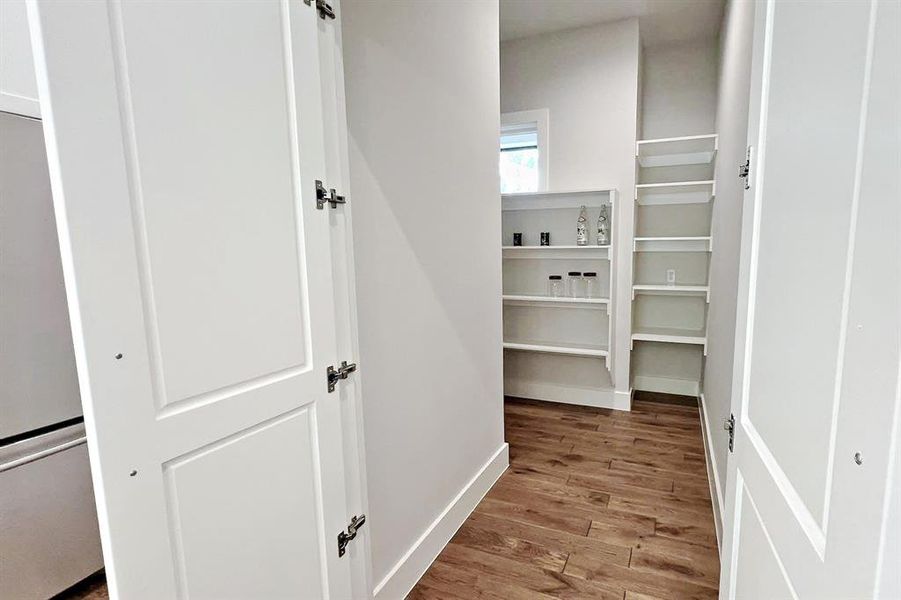 A spacious Walk-In Hidden Pantry keeps everything organized and within reach. There is plenty of storage space for all your kitchen essentials including an outlet for small appliances. A spacious Walk-In Hidden Pantry keeps everything organized and within reach. There is plenty of storage space for all your kitchen essentials including an outlet for small appliances.