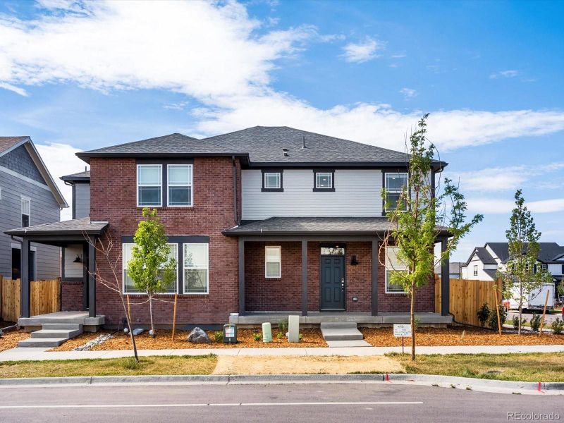 Front exterior of a new home in Horizon Uptown: The Mountain Collection, Aurora, CO, highlighting curb appeal (Image 2). Front exterior of a new home in Horizon Uptown: The Mountain Collection, Aurora, CO, highlighting curb appeal (Image 2).