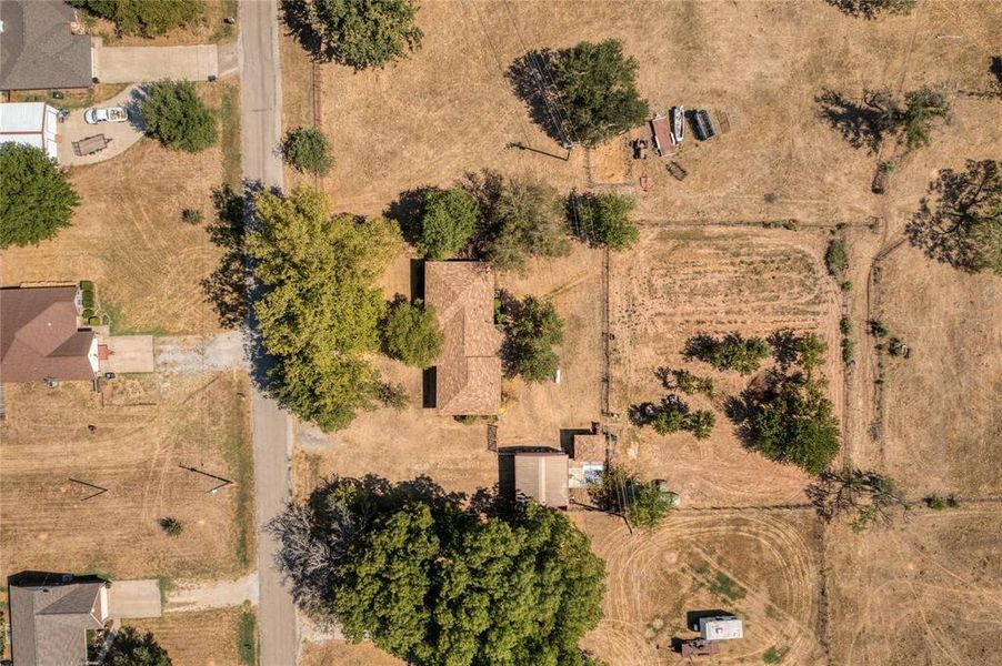 Aerial View of Home and Backyard features Garage and Shed