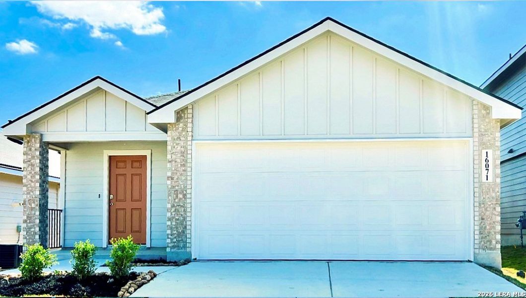 Front exterior of a new home in Hickory Ridge, Elmendorf, TX, highlighting curb appeal (Image 2).
