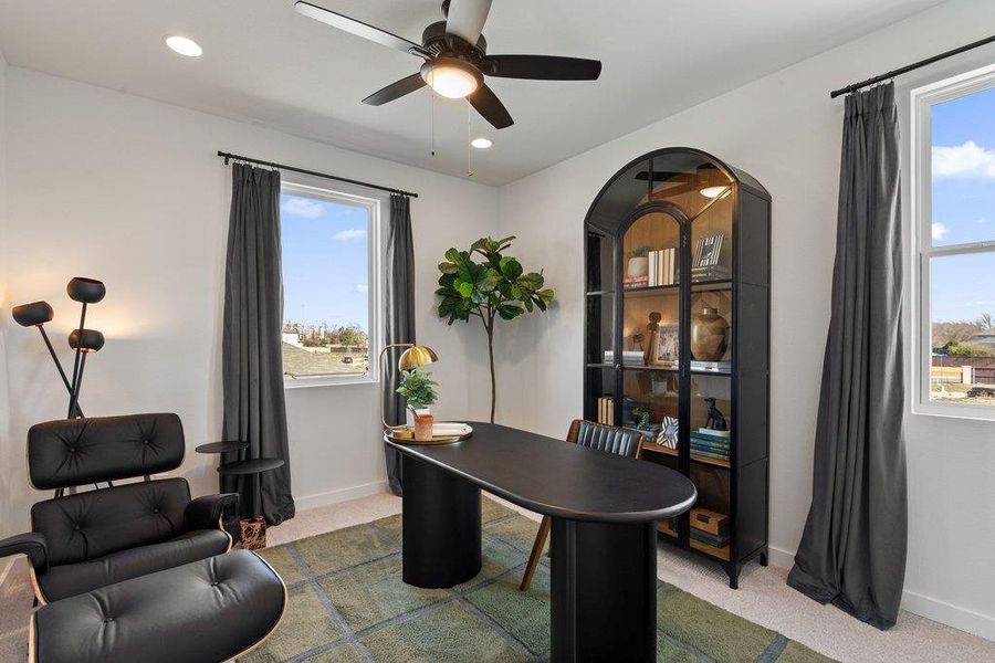 Room featuring two windows with dark drapery, a ceiling fan with integrated lighting, and recessed ceiling lights
