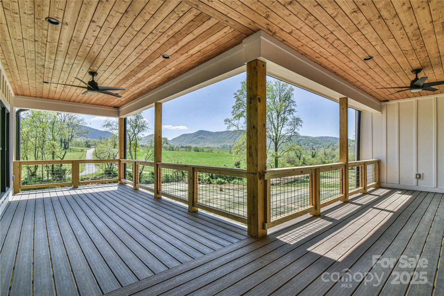 Large covered back deck for entertaining and enjoying the view! Similar photo.