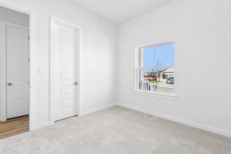 Spacious, unfurnished interior of a new home in The Colony, Bastrop (Image 26).