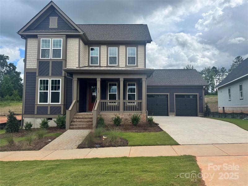 Front exterior of a new home in Riverwalk, Rock Hill, SC, highlighting curb appeal (Image 1). Front exterior of a new home in Riverwalk, Rock Hill, SC, highlighting curb appeal (Image 1).