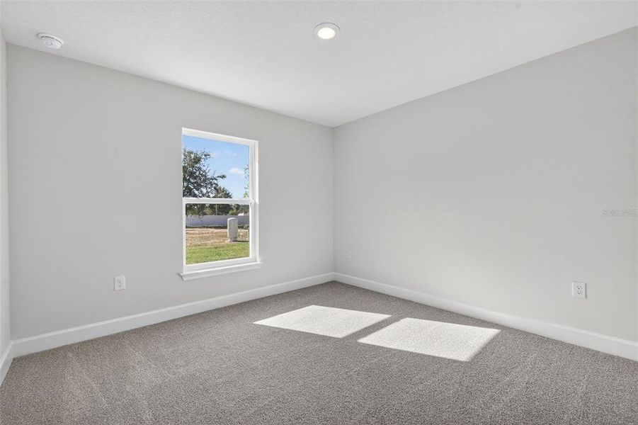 Spacious, unfurnished interior of a new home in Hill Country Estates, Dade City (Image 64).